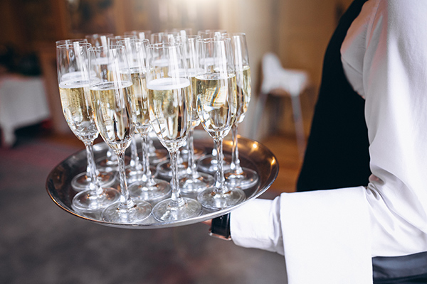 waiter-serving-beverage-tray-restaurant