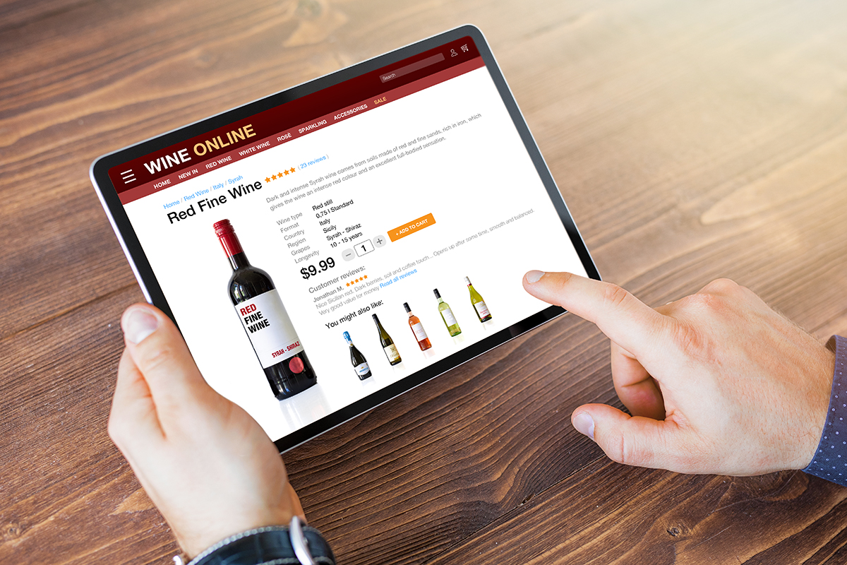 person-holding-tablet-buying-wine-online